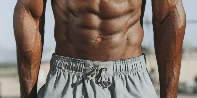 Man doing push ups on bars